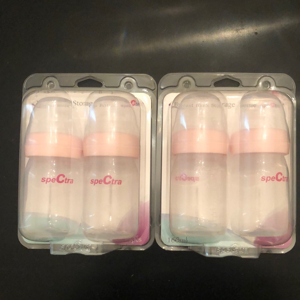 Two sets of Spectra storage bottles